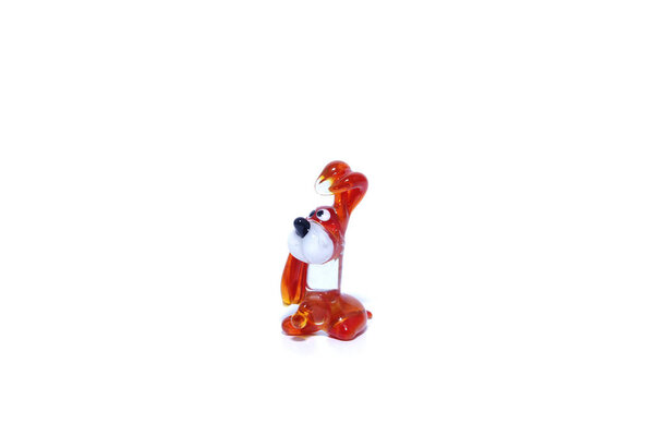 Toy decorative glass on a white background. Animals, dogs, frogs.