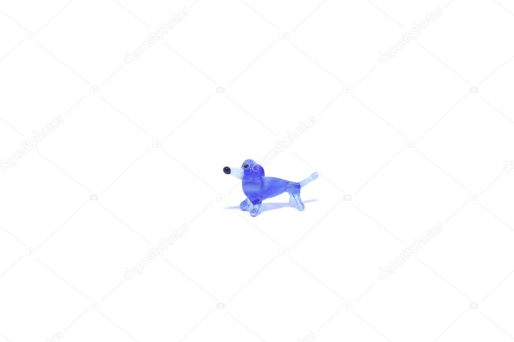 Toy decorative glass on a white background. Animals, dogs, frogs.