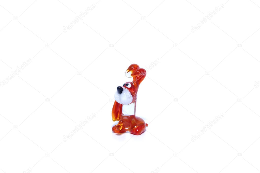 Toy decorative glass on a white background. Animals, dogs, frogs.