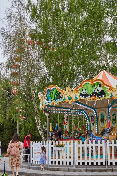 Children's carousel with horses. Cheboksary, Russia, 05/11/2019 — Stock Photo, Image