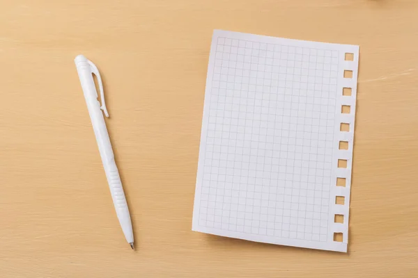 A sheet for notes on a wooden table. — Stock Photo, Image