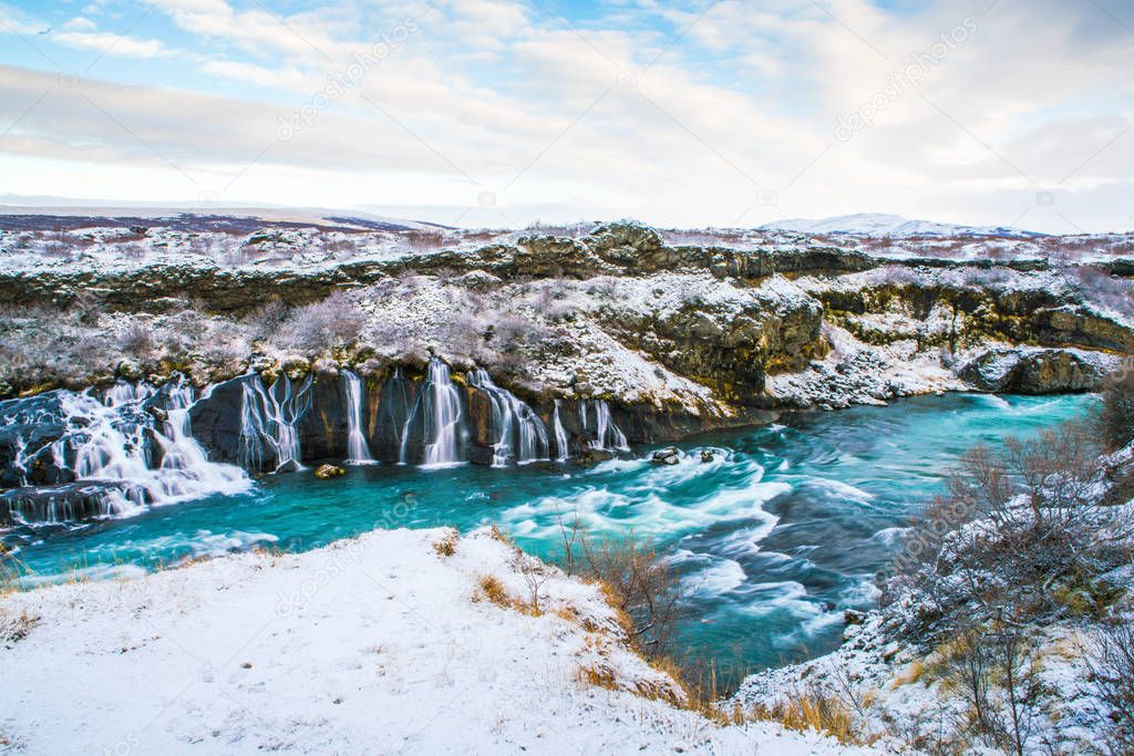 Hraunfossar, a waterfall formed by rivulets streaming over Hallmundarhraun, a lava field from volcano lying under the glacier Langjokull, and pour into the Hvita river, Iceland