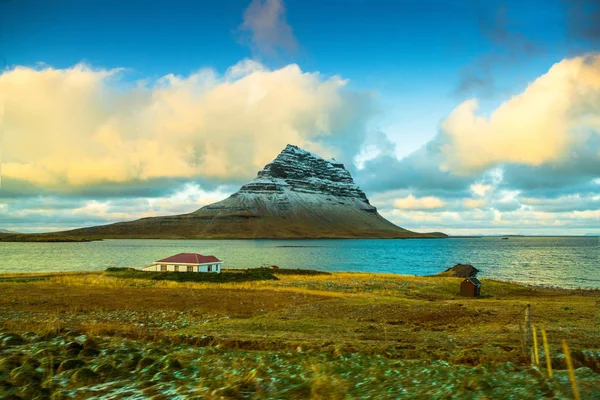 Kirkjufell (Icelandic, Church mountain), a 463 m high mountain on the north coast of Icelands Snaefellsnes peninsula, near the town of Grundarfjordur, Iceland