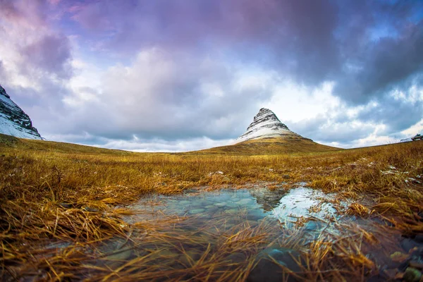 Kirkjufell (Icelandic, Church mountain), a 463 m high mountain on the north coast of Icelands Snaefellsnes peninsula, near the town of Grundarfjordur, Iceland