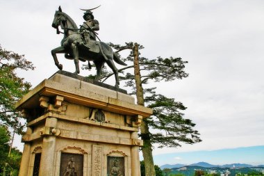 Statue of Masamune Date (the lord of Tohoku region in the Sengoku era) in Sendai castle park (or Aoba castle) on Mount Aoba, Sendai, Miyagi Prefecture, Tohoku region, Japan clipart
