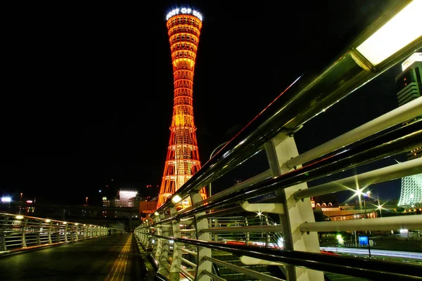 Kobe Port Tower ( Kbe Pto Taw), a 108 m high lattice tower in the port city of Kobe, Hygo Prefecture, Kansai region, Japan.