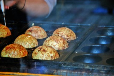 Dev Takoyaki yemek pişirme tavasında