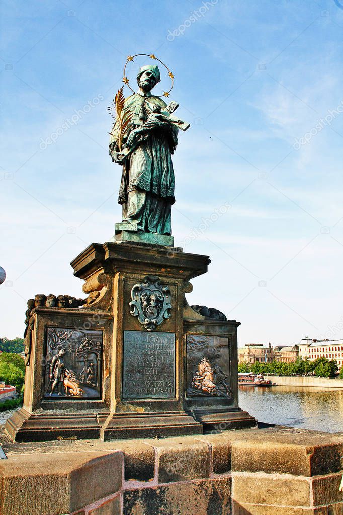Statue of St. John of Nepomuk (socha sv. Jana Nepomuckho), the oldest statue on Charles bridge (or Karluv most), Prague (Praha), Czech Republic (Ceska Republika), Bohemia