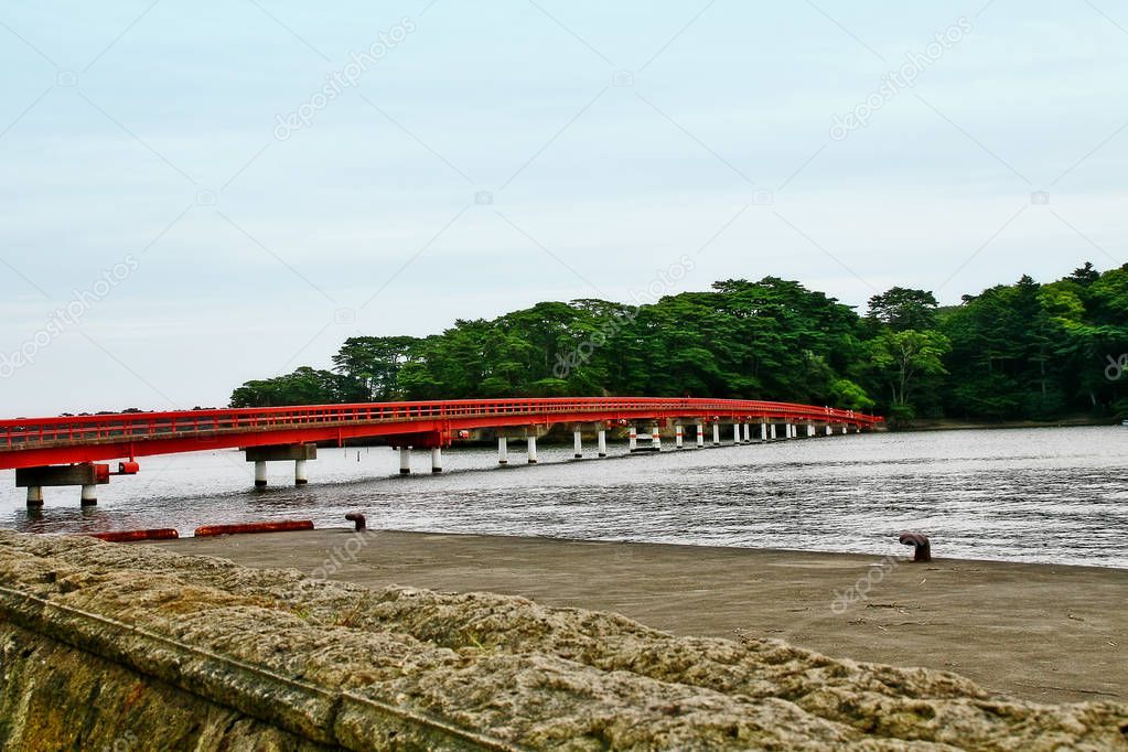 Scene of bay and red bridge (Fukuurabashi) cross to Fukuurajima Island, one of small Islands in Matsushima (Matsushima-machi), Miyagi Prefecture, Tohoku region, Japan