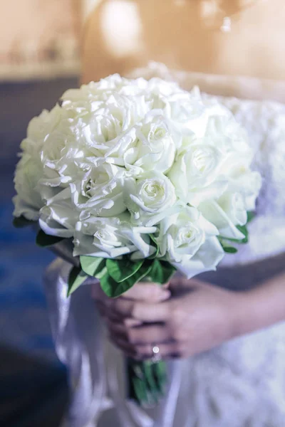 Bride hold flower bouquet in wedding ceremony