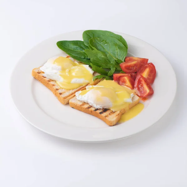 Plate of breakfast with fried eggs, toasts, tomato isolated on white backgound — Stock Photo, Image