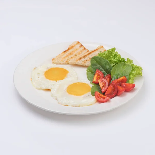 Plate of breakfast with fried eggs, toasts, tomato isolated on white backgound — Stock Photo, Image