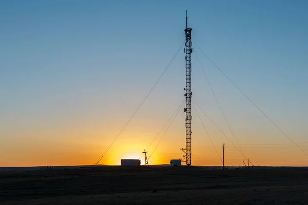 Cell phone tower at sunset — Stock Photo, Image