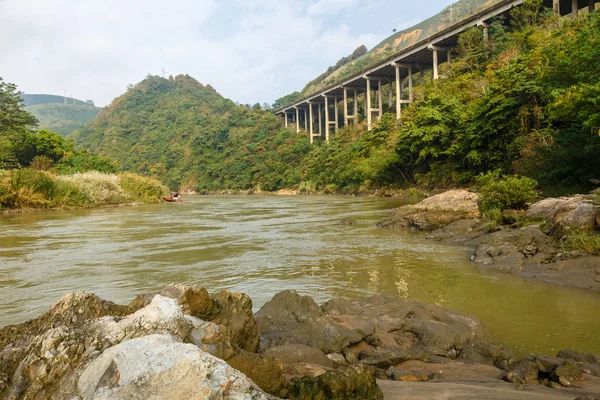 The highway on the Red River is the border between Vietnam and China, Yunnan Province, China