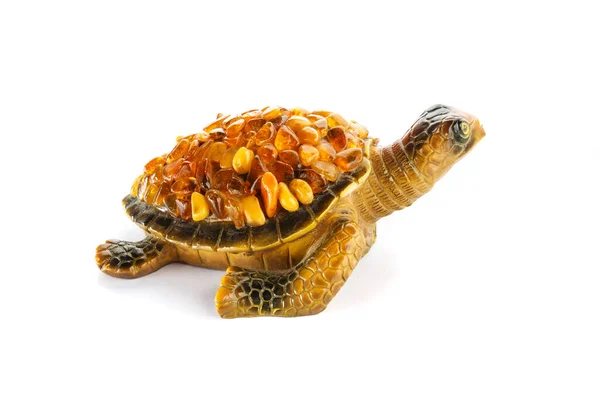 Figuur Van Een Schildpad Een Witte Achtergrond Met Amberkleurige Stenen — Stockfoto