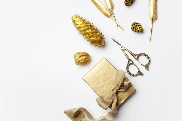 Christmas composition. christmas golden decorations on light background. Top view, flat lay
