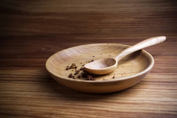 Digiuno, Quaresima. Piatto con cucchiaio e briciola su fondo di legno — Foto Stock