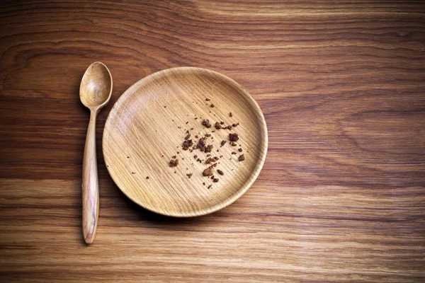 Ayunando, Cuaresma. Placa con cuchara y miga sobre fondo de madera — Foto de Stock