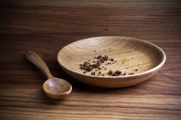 Fasten, Fasten. Teller mit Löffel und Krume auf Holzgrund — Stockfoto