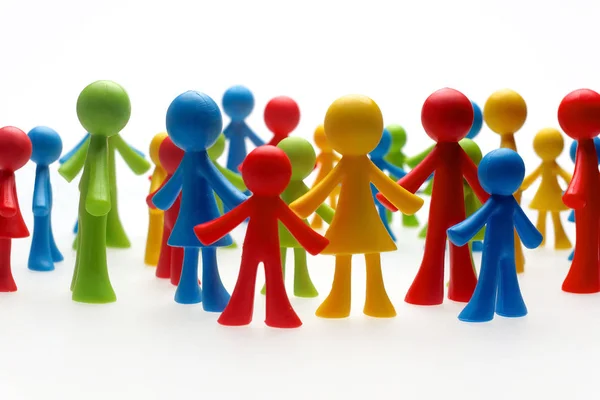 Colorful painted group of people figures on white background — Stock Photo, Image