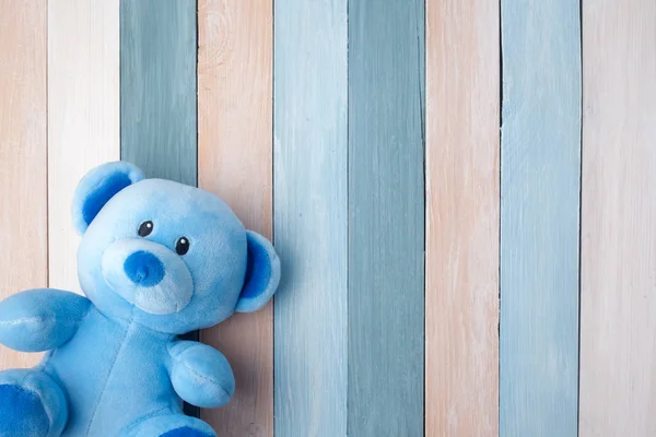 Teddy Bear toy alone on pastel wooden background — Stock Photo, Image