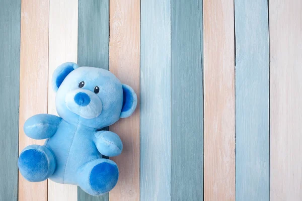 Teddy Bear toy alone on pastel wooden background — Stock Photo, Image