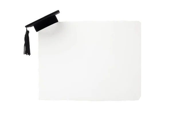 Black Graduation cap on blank white billboard — Stock Photo, Image