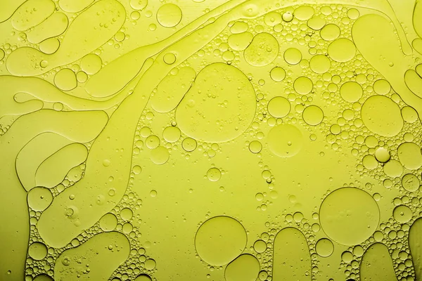 Yellow oil with bubbles. Abstract texture background — Stock Photo, Image