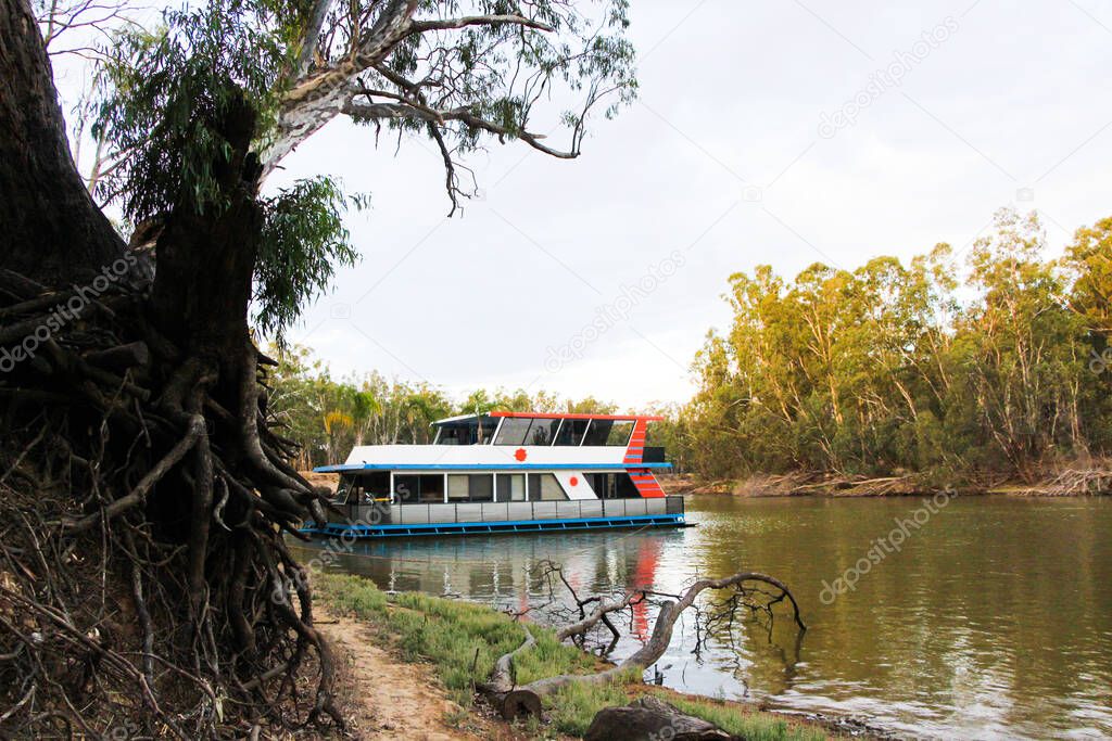 House boat / river boat docked for the night on the Murray River, Victoria.