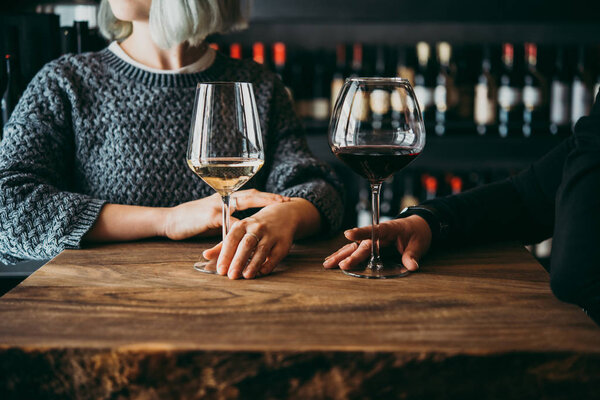 Young women enjoying their wine in a bar