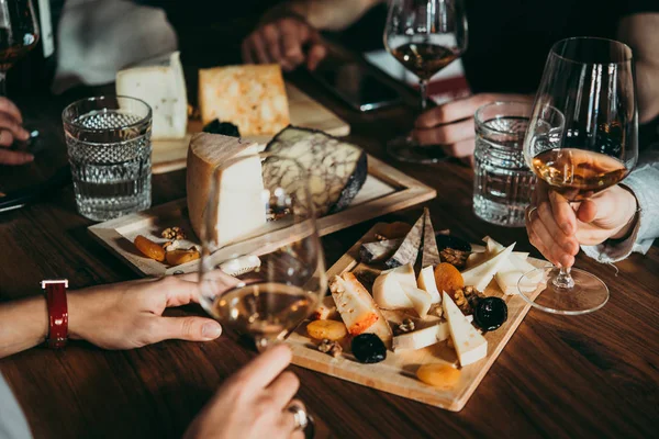 Wine and cheese served for a friendly party in a bar or a restaurant.