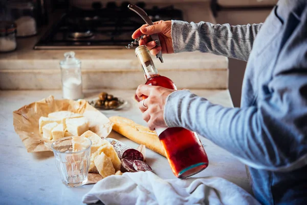 Hands Opening Bottle Rose Wine Cheese Snacks Background — Stock Photo, Image