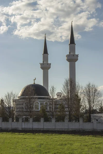 Islam Muslim mosque two minarets. Beautiful photo of mosque, place of worship. Ramadan Islamic religious architecture