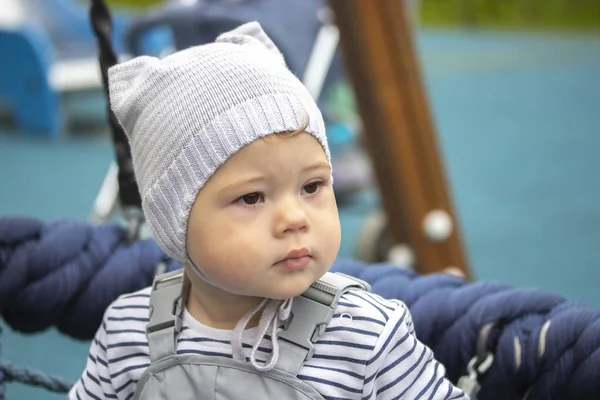 Portrait of baby girl boy 1 year old on a walk, close-up face of a child Stock Picture