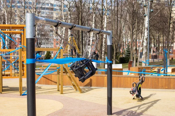 The playground is closed for quarantine, isolation during a pandemic. The ban on walking on the street, a swing ladder for children sports complex. Coronavirus quarantine, respiratory virus epidemic