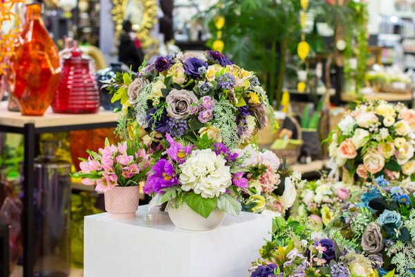 Bouquets of artificial flowers, rose hydrangea violet crocus, floristry. The art of making bouquets, flower sales, interior design