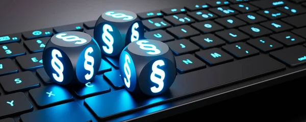 Leuchtende Wuerfel mit Paragraphen-Symbol auf Tastatur