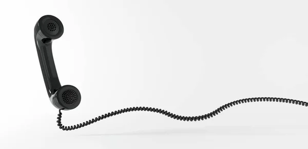 Schwebender schwarzer Telefonhoerer mit Spiralkabel
