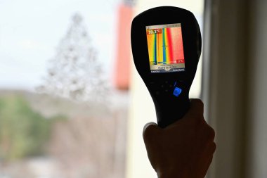 Hand thermal imaging camera to check temperature . clipart