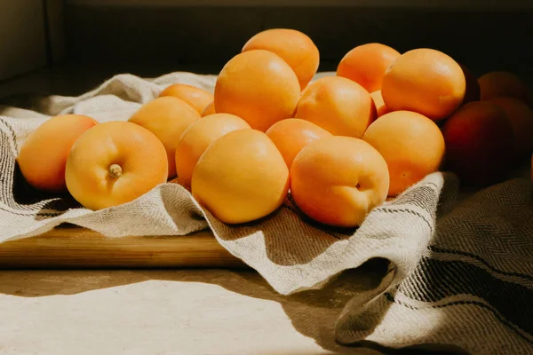 Orange apricots on a towel — Stock Photo, Image