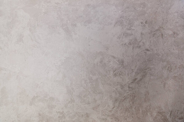 Texture of gray decorative plaster with the effect of wet silk. 