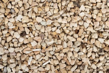 Beyaz çakıl ve beton levhanın makro dokusu.