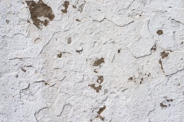 Beyaz beton bir duvarda soyulmuş boyanın makro dokusu.