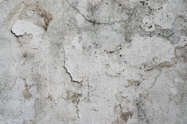 Beyaz beton bir duvarda soyulmuş boyanın makro dokusu.