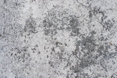 Beyaz beton bir duvarda soyulmuş boyanın makro dokusu.