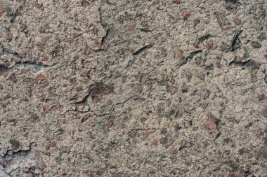 Beton duvar ve temel dokusu. Küçük çakıl taşları ve yontulmuş.