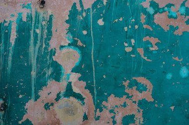 Eski desen ve beton duvardaki yeşil boya.