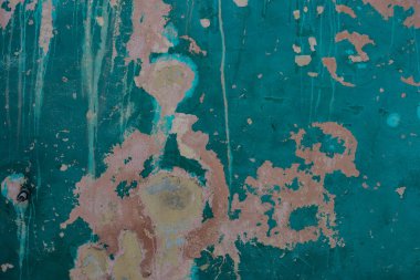 Eski desen ve beton duvardaki yeşil boya.