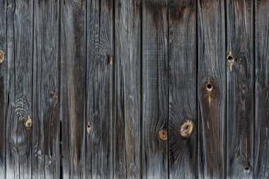 Eski ahşap çitin dokusu koyu renk.