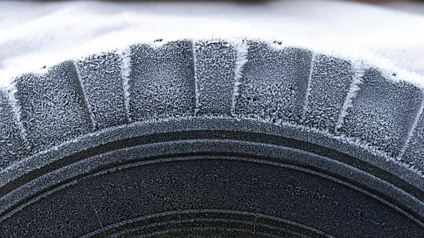 Frost on the tire of a car wheel in winter